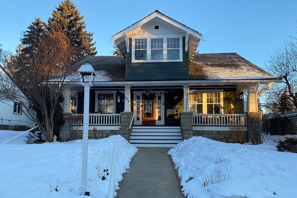 Residential snow removal in Edmonton driveway and sidewalk after winter snowfall