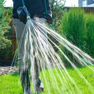 Hero spraying fertilizer and weed killer - front view
