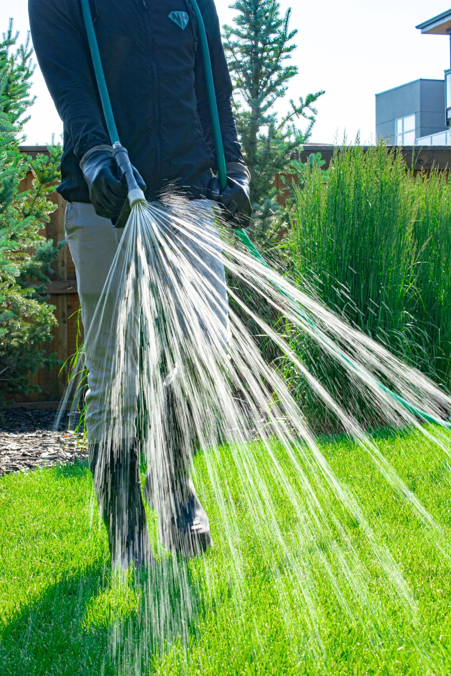 Hero spraying fertilizer and weed killer - front view