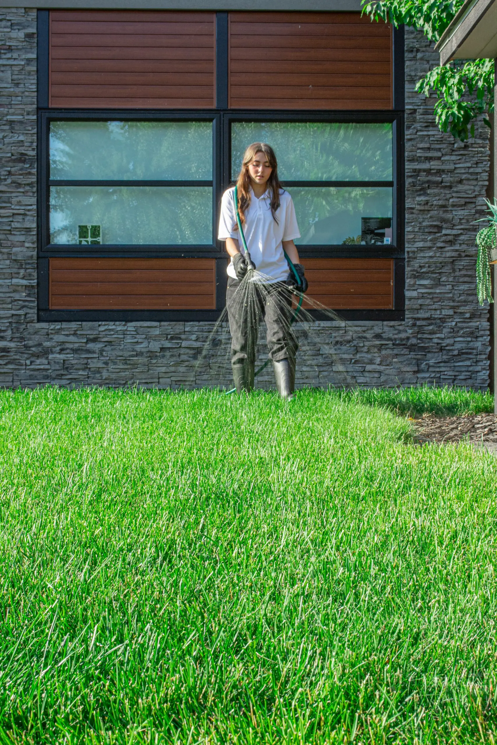 Hero spraying fertilizer and weed killer